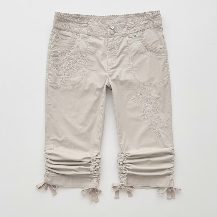 Capri pants trims, buttons, and finishing details